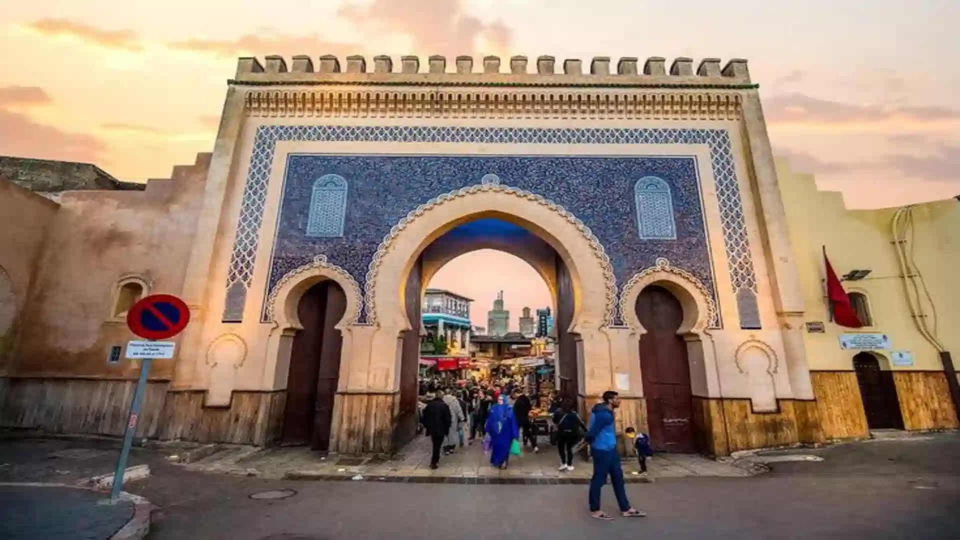Iconic Bab Bou Jeloud blue tile gate leading into the historic Fes Medina answering what does Medina mean.